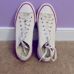 All white converse with a red stripe